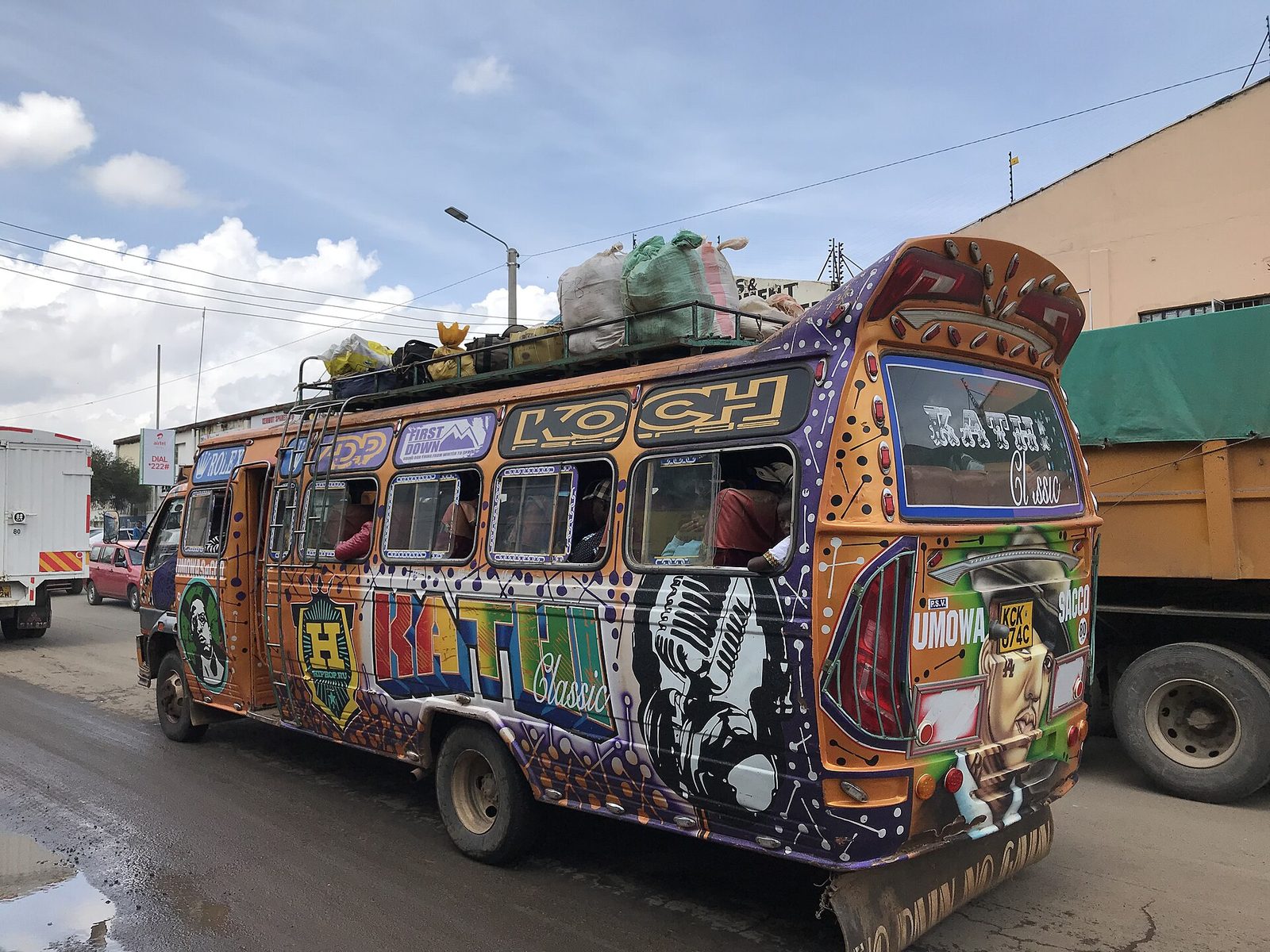 A graffiti-covered matatu on a Nairobi road
