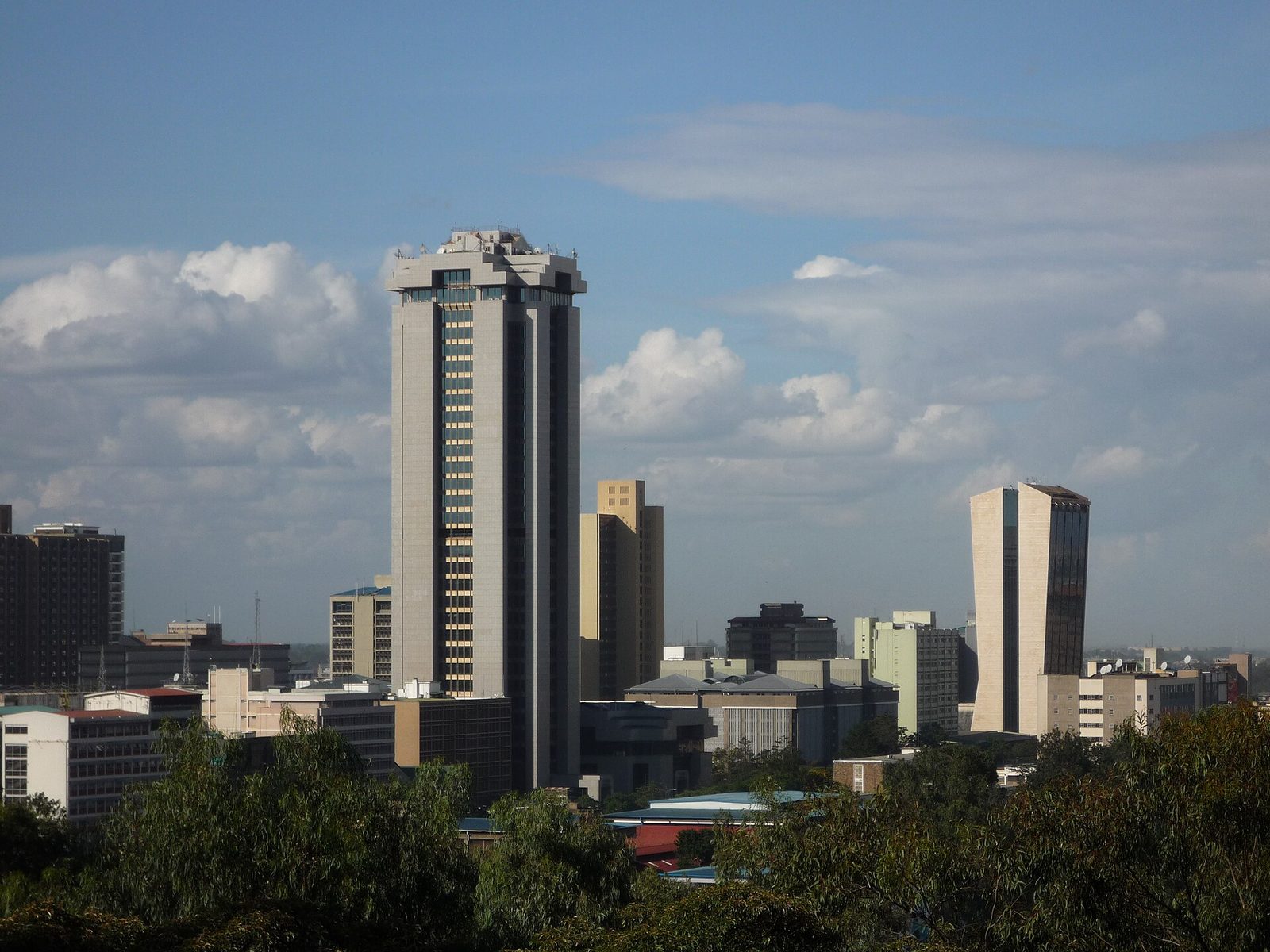 The Nairobi city skyline under a cloudy sky