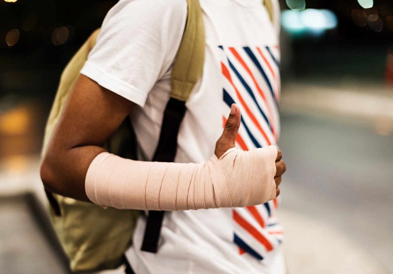 A person's arm in a bandage after an accident